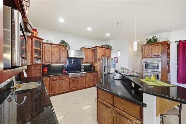 a kitchen with lots of counter top space and living room