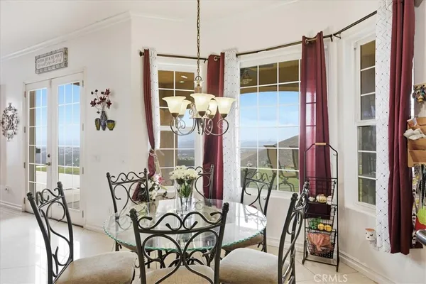 a large kitchen with a table and chairs