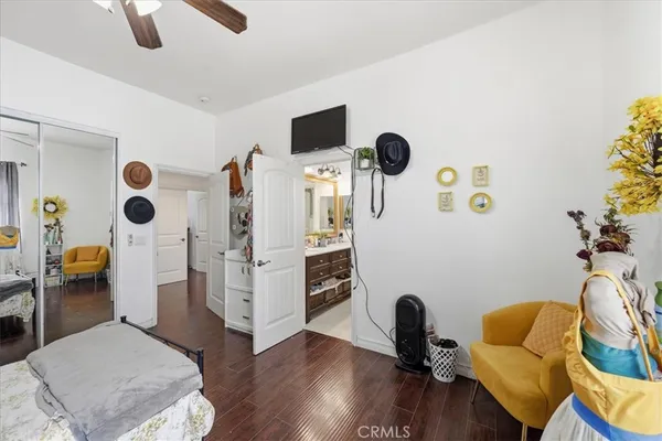 a bathroom with a sink mirror vanity and toilet