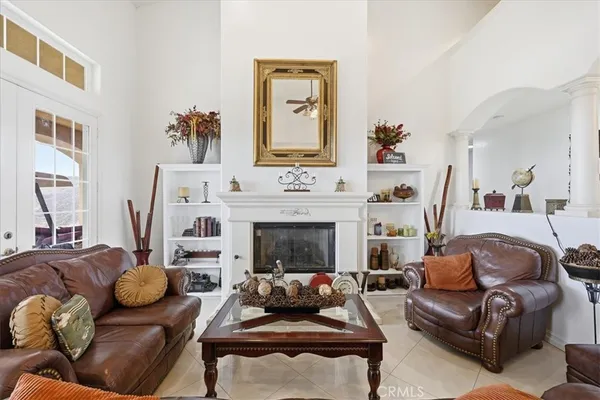 a living room with furniture and a fireplace