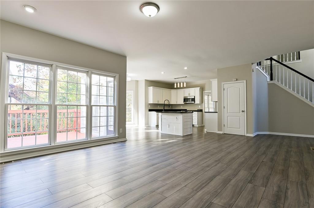 2670 Factor Walk Boulevard Suwanee, GA 30024 - Photo 14 of 57 a view of an empty room with wooden floor and a window