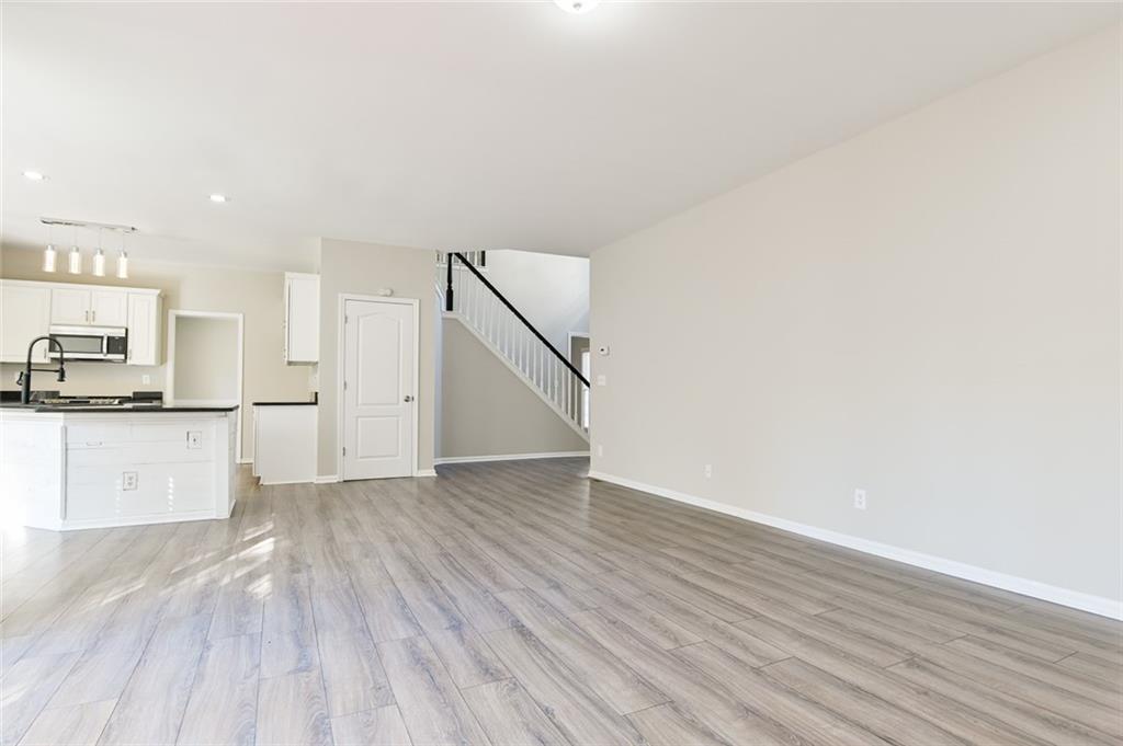 2670 Factor Walk Boulevard Suwanee, GA 30024 - Photo 15 of 57 a view of a kitchen with wooden floor and electronic appliances
