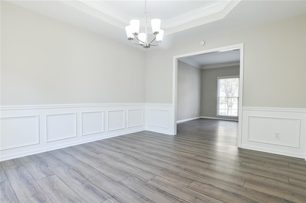 2670 Factor Walk Boulevard Suwanee, GA 30024 - Photo 17 of 57 a view of an empty room with wooden floor
