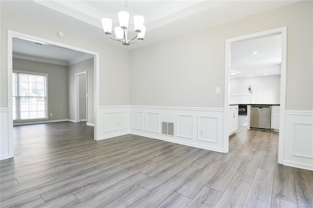 2670 Factor Walk Boulevard Suwanee, GA 30024 - Photo 18 of 57 wooden floor in an empty room with a window