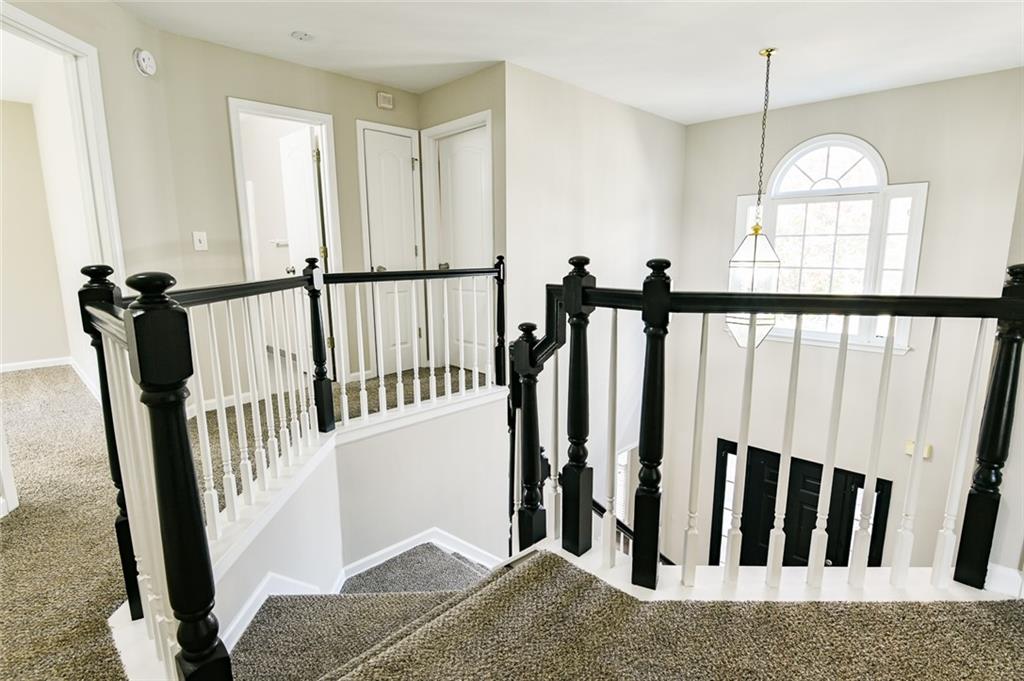 2670 Factor Walk Boulevard Suwanee, GA 30024 - Photo 37 of 57 a view of hallway with wooden floor and stairs