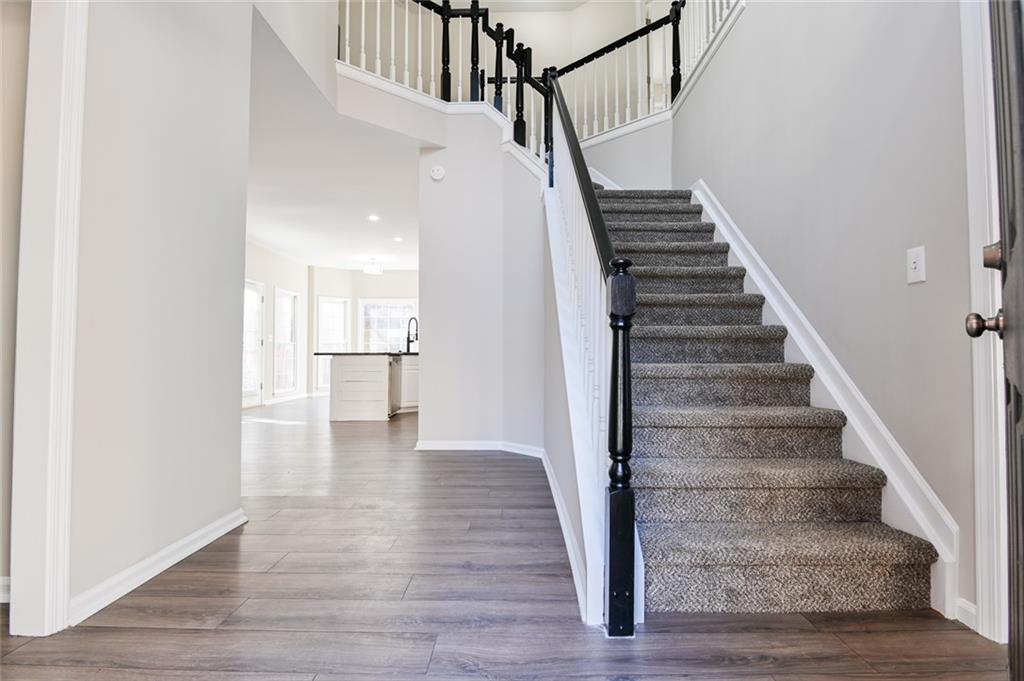 2670 Factor Walk Boulevard Suwanee, GA 30024 - Photo 4 of 57 a view of entryway and hall with wooden floor