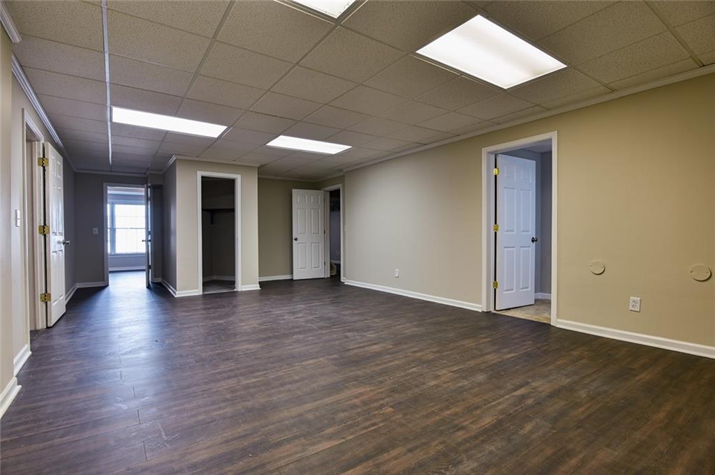 2670 Factor Walk Boulevard Suwanee, GA 30024 - Photo 42 of 57 an empty room with wooden floor and windows