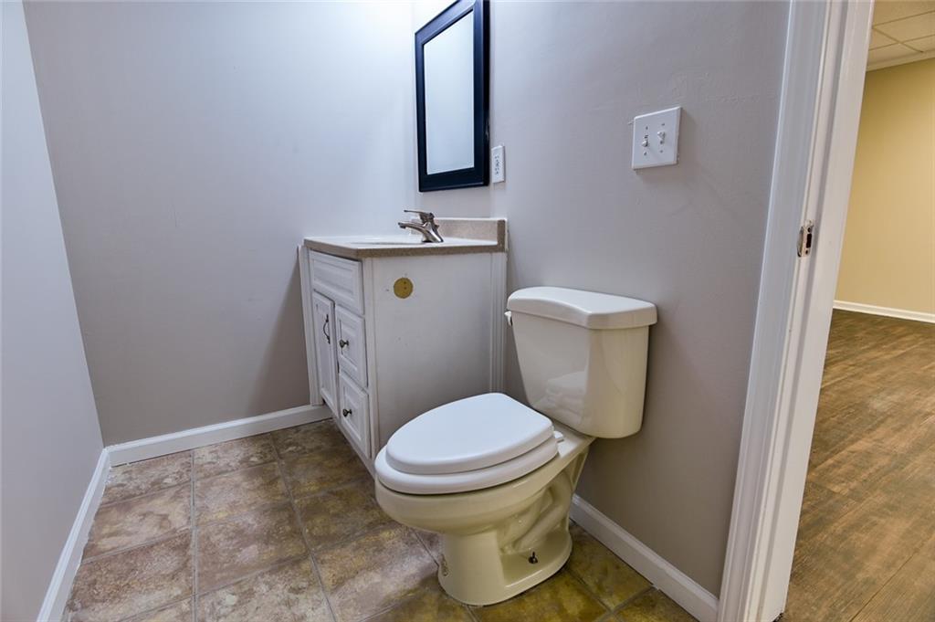 2670 Factor Walk Boulevard Suwanee, GA 30024 - Photo 44 of 57 a bathroom with a toilet and a sink