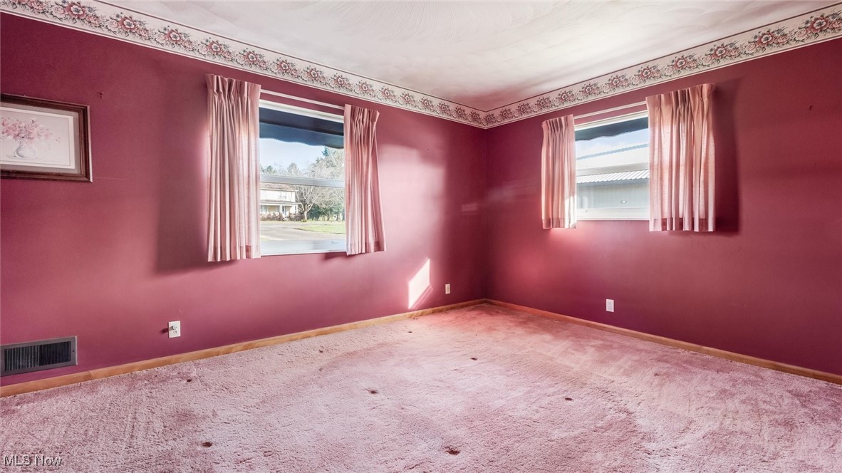 1950 Newark Road Zanesville, OH 43701 - Photo 17 of 39 Empty room featuring carpet