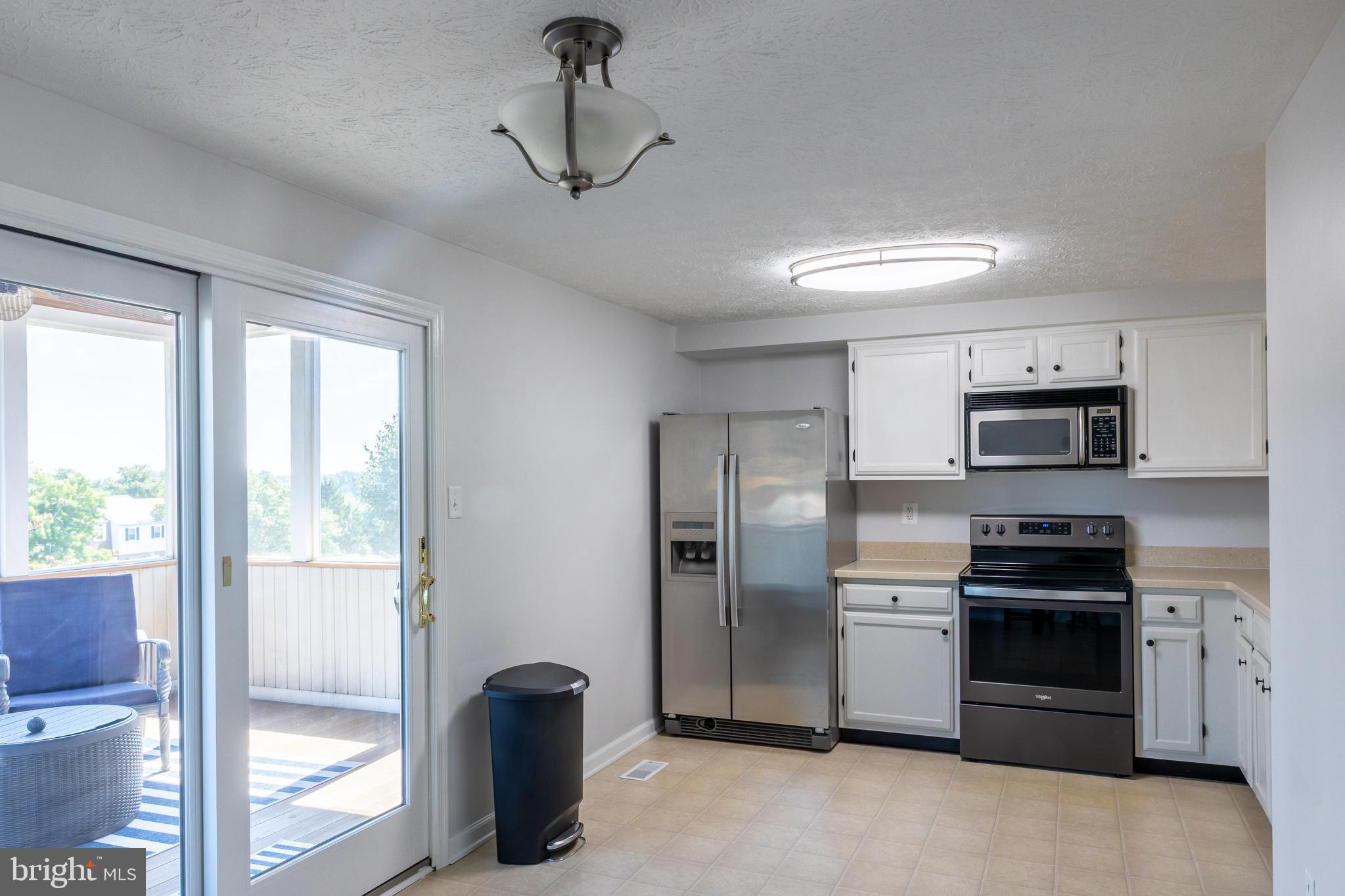 3 Greenleaf Road Parkville, MD 21234 - Photo 5 of 25 Very Spacious Kitchen opens to Upper level Patio.