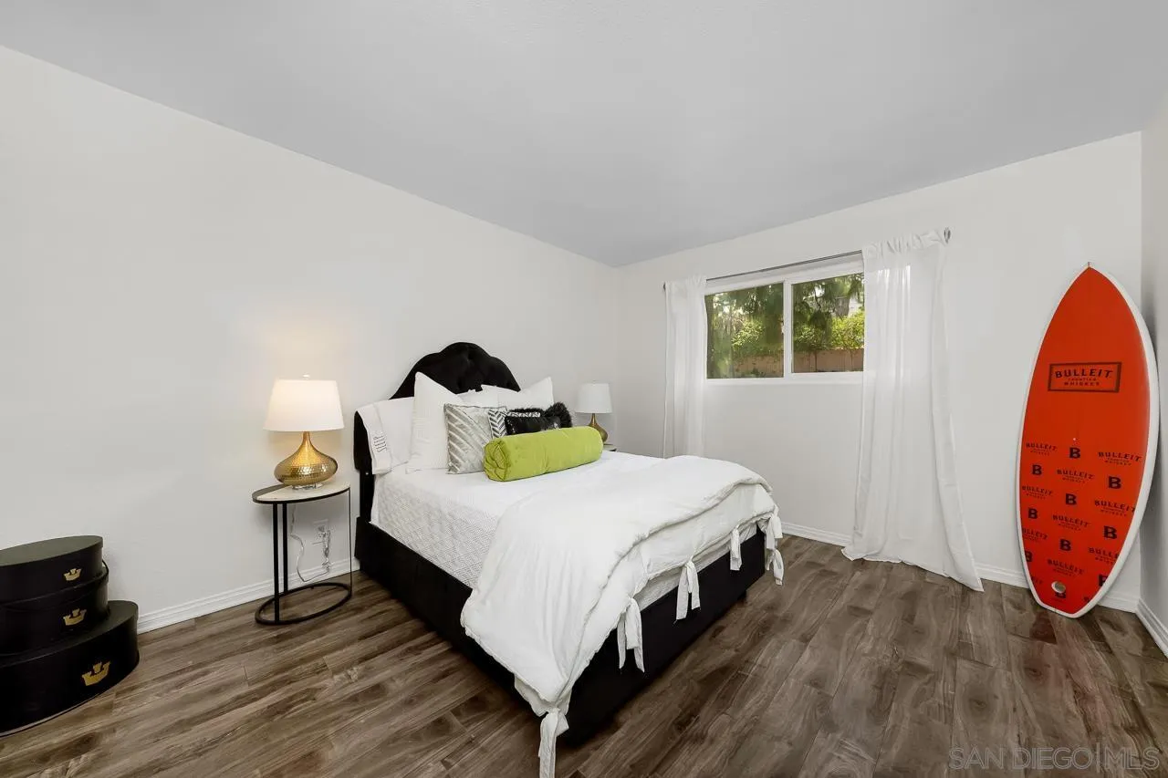 9860 Dale Avenue, Unit C3 Spring Valley, CA 91977 - Photo 10 of 26 a bed sitting in a bedroom next to a window
