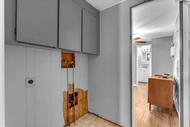 a view of hallway with wooden floor