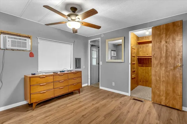 a room with furniture and wooden floor