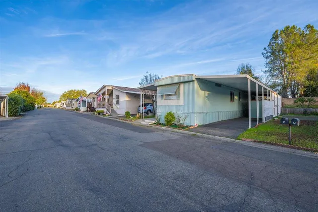 a view of a house with a street