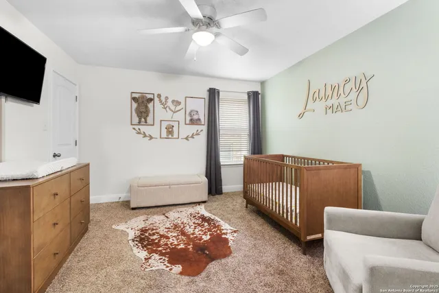a bedroom with furniture and a window