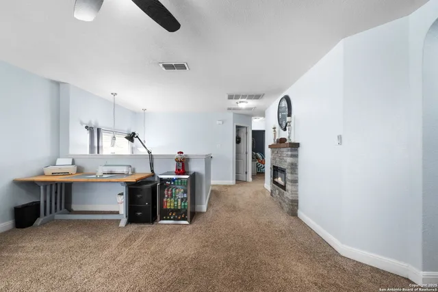 a view of work space with furniture and window