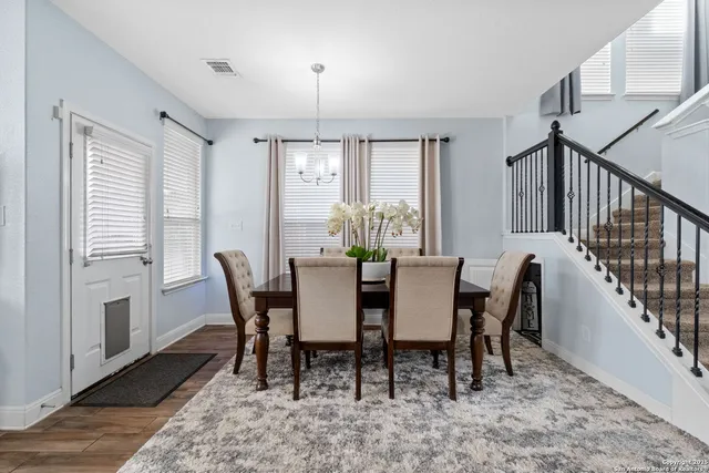 a view of a dining room with furniture window and wooden floor