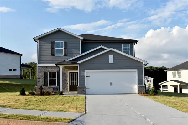 a view of a house with swimming pool and yard