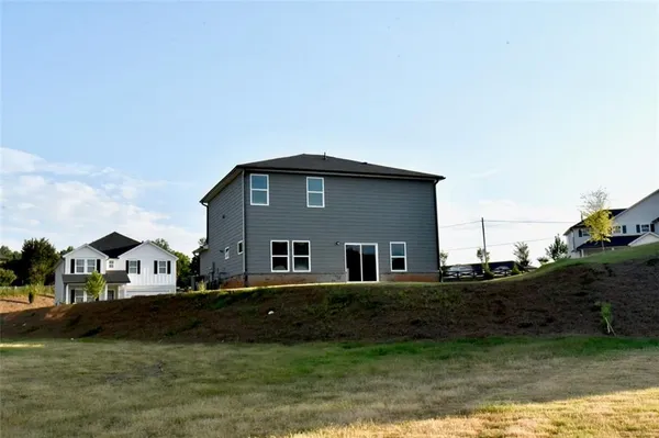 a house view with swimming pool in front of it