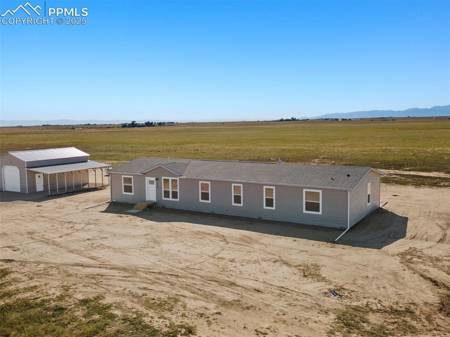 2170 East Ellicott Road South Calhan, CO 80808 - Photo 1 of 1 View of front of property with a view of rural / pastoral area and an outdoor structure