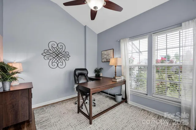 a workspace with furniture and a window