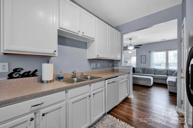 a kitchen with sink and cabinets