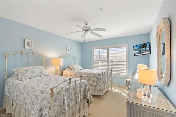 a bedroom with double bed and a window