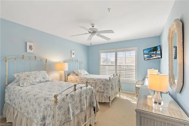 a bedroom with double bed and a window