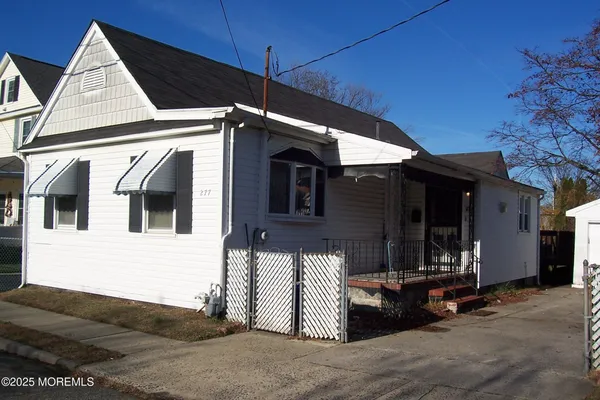 a front view of a house with garage