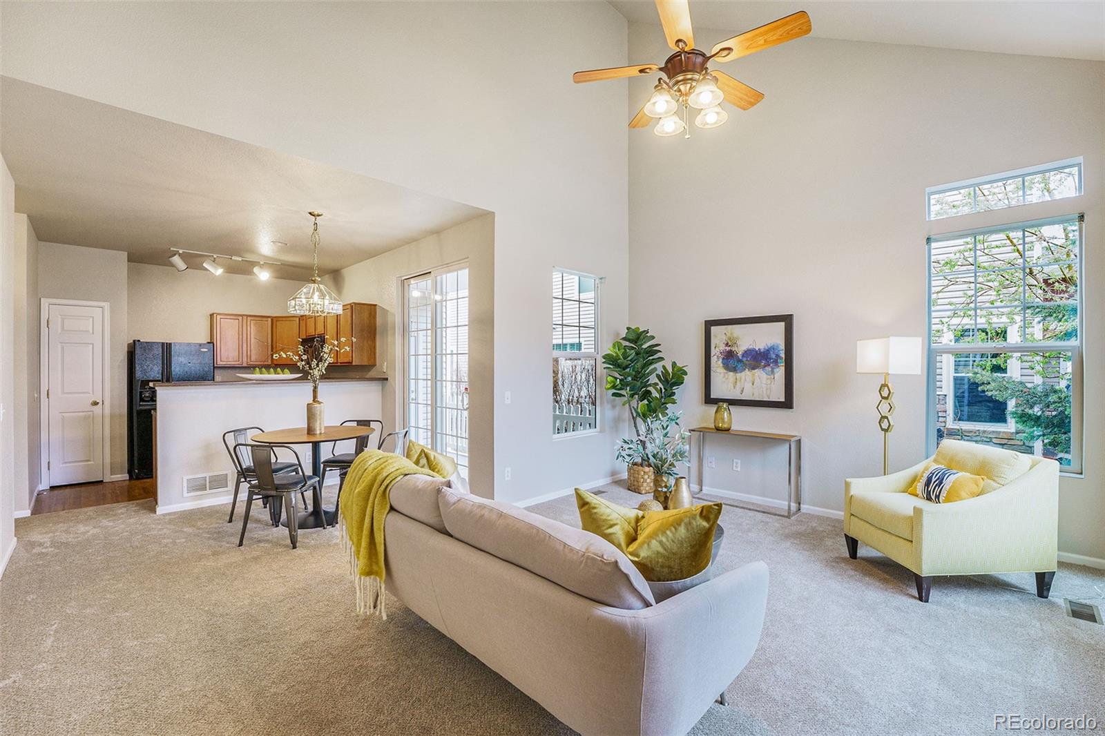 4623 Flower Street Wheat Ridge, CO 80033 - Photo 1 of 23 a living room with furniture and a table