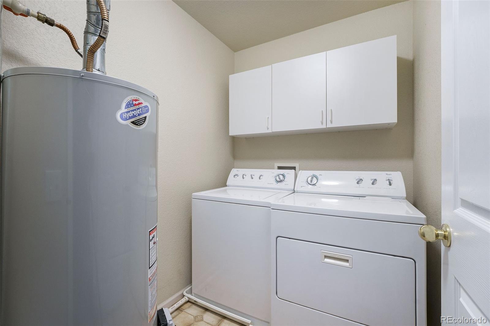 4623 Flower Street Wheat Ridge, CO 80033 - Photo 15 of 23 a utility room with dryer and washer