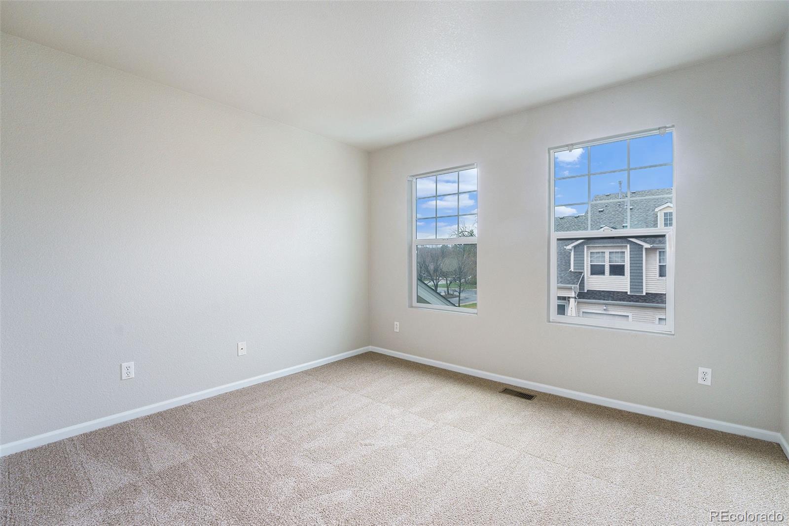 4623 Flower Street Wheat Ridge, CO 80033 - Photo 17 of 23 an empty room with windows