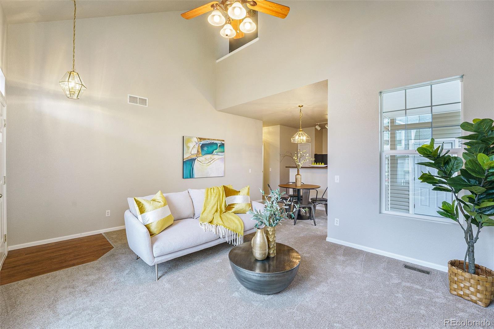 4623 Flower Street Wheat Ridge, CO 80033 - Photo 4 of 23 a living room with furniture and a potted plant