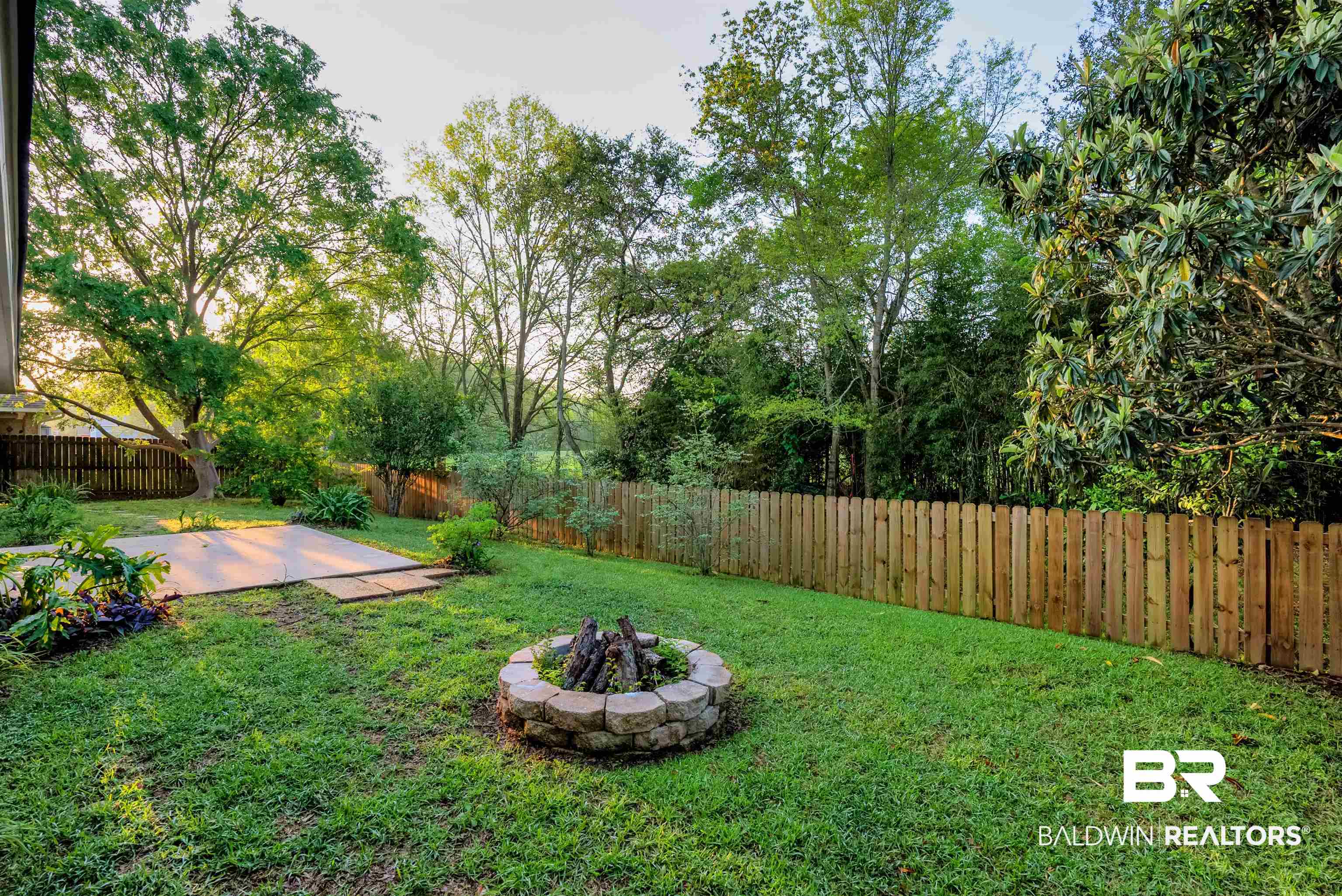 165 Pemberton Loop Fairhope, AL 36532 - Photo 22 of 25 View of yard with a fenced backyard, an outdoor fire pit, and a patio
