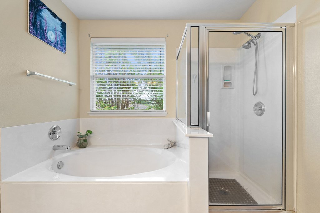 140 Wolfberry Path Buda, TX 78610 - Photo 25 of 35 a white bath tub sitting next to a shower