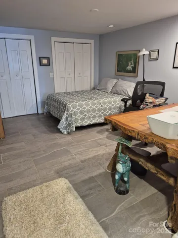 a bedroom with furniture and a bed