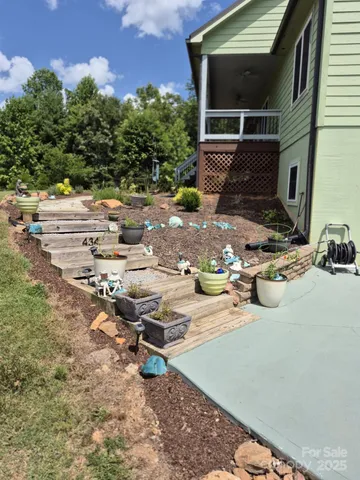 a view of backyard with sitting area
