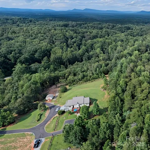 an aerial view of a city and mountain view in back