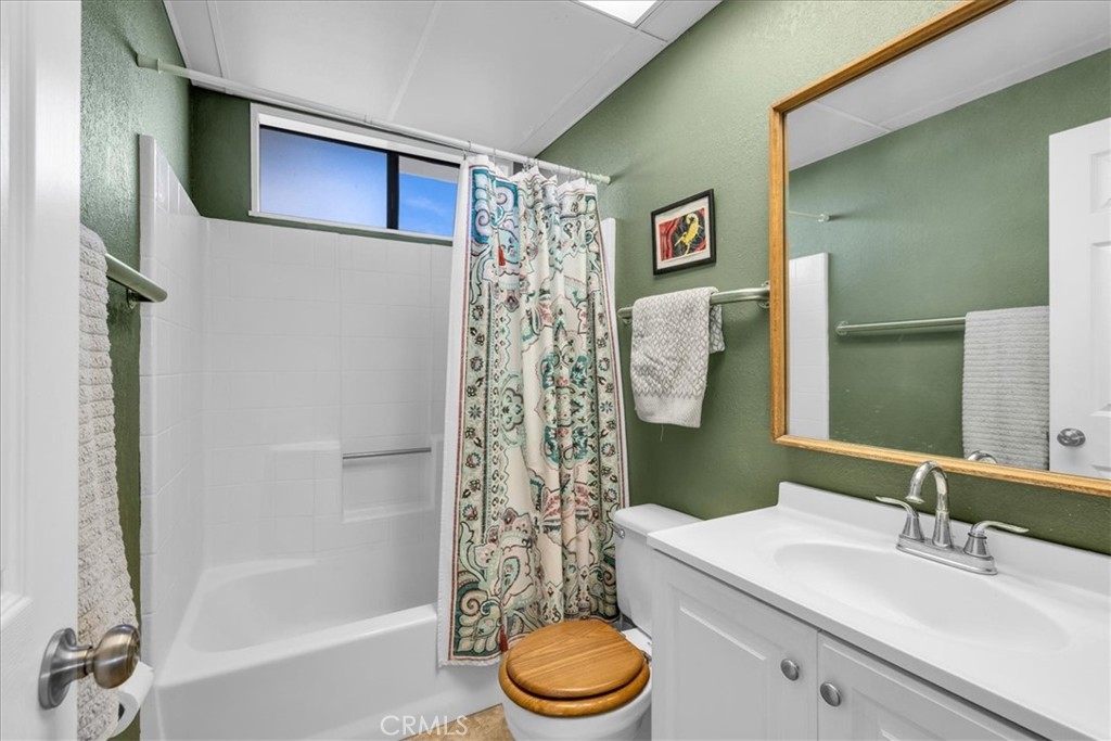 437 Mallow Road Landers, CA 92285 - Photo 24 of 52 a bathroom with a sink toilet and shower