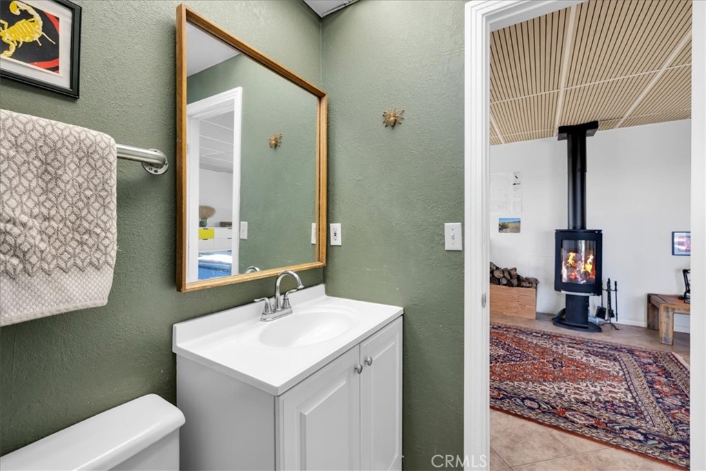 437 Mallow Road Landers, CA 92285 - Photo 25 of 52 a en suite bathroom with a sink and a mirror