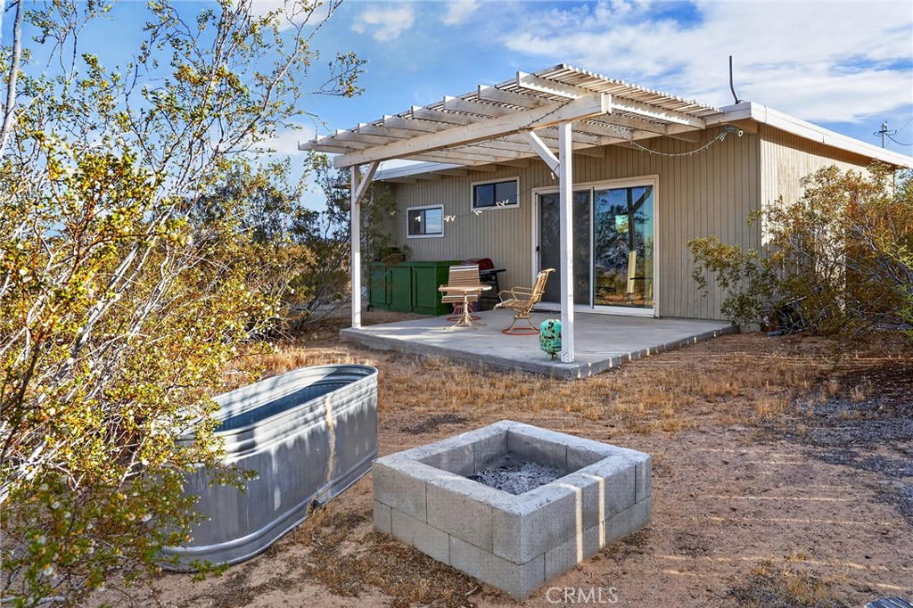 437 Mallow Road Landers, CA 92285 - Photo 28 of 52 a view of a chair and table in the patio