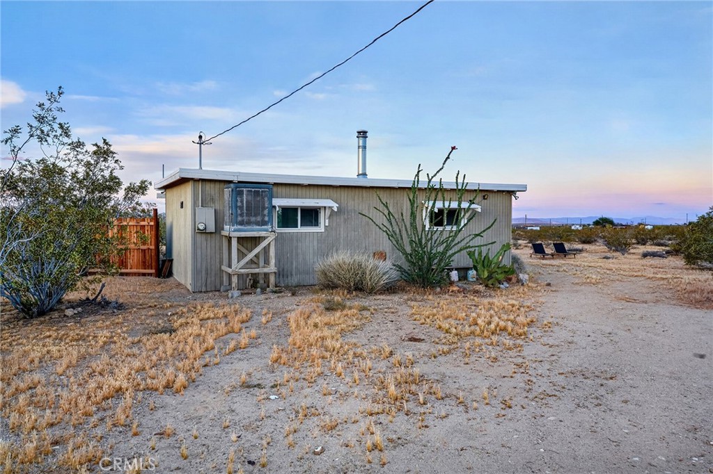 437 Mallow Road Landers, CA 92285 - Photo 33 of 52 a view of a house with a backyard