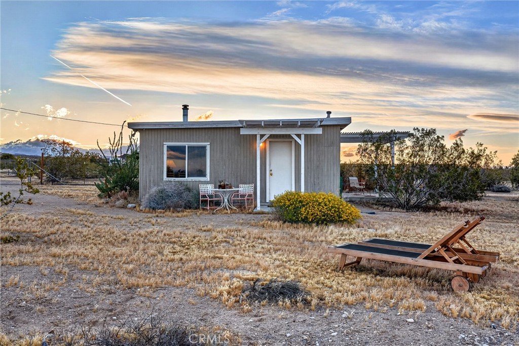 437 Mallow Road Landers, CA 92285 - Photo 35 of 52 a backyard of a house with table and chairs