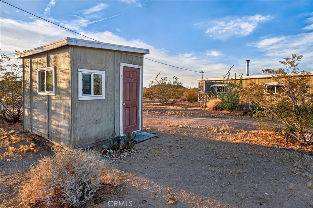437 Mallow Road Landers, CA 92285 - Photo 37 of 52 a view of a house with a yard