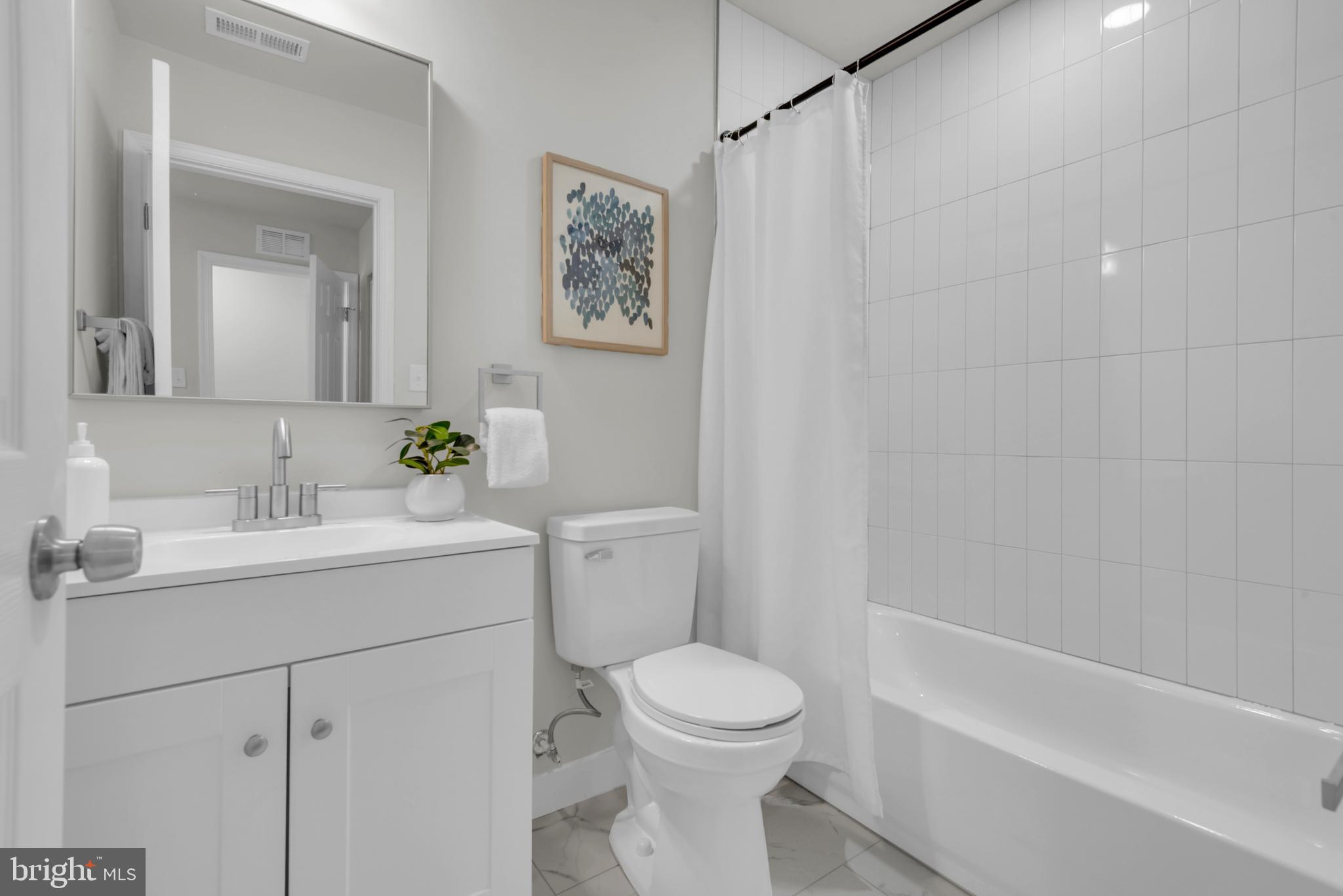 928 Riversedge Circle Annapolis, MD 21401 - Photo 22 of 37 a bathroom with a sink toilet and shower