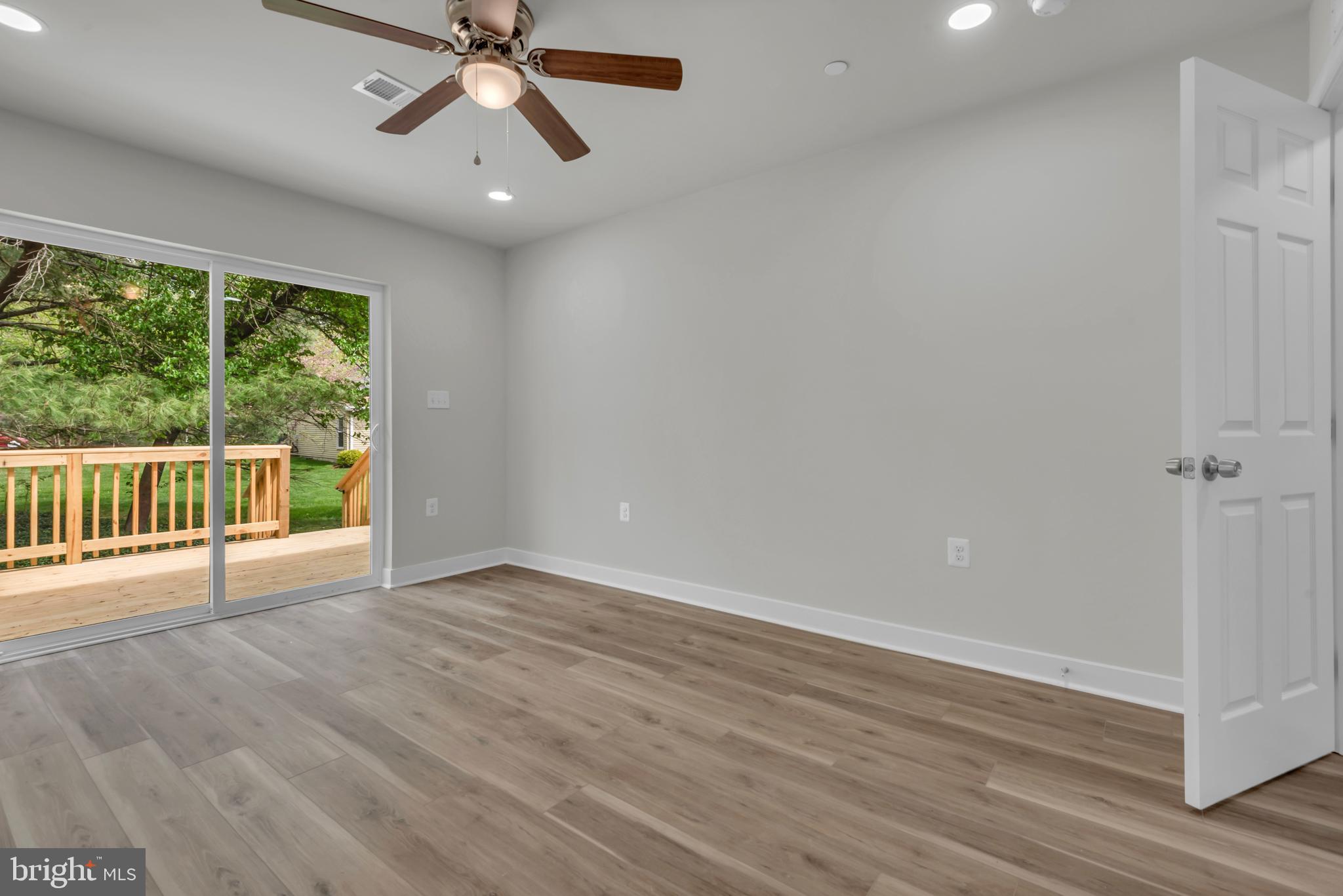 928 Riversedge Circle Annapolis, MD 21401 - Photo 25 of 37 wooden floor in an empty room with a window