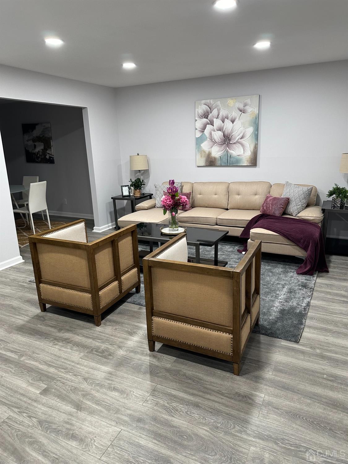 45 Raleigh Road Kendall Park, NJ 08824 - Photo 3 of 13 a living room with furniture and a flat screen tv