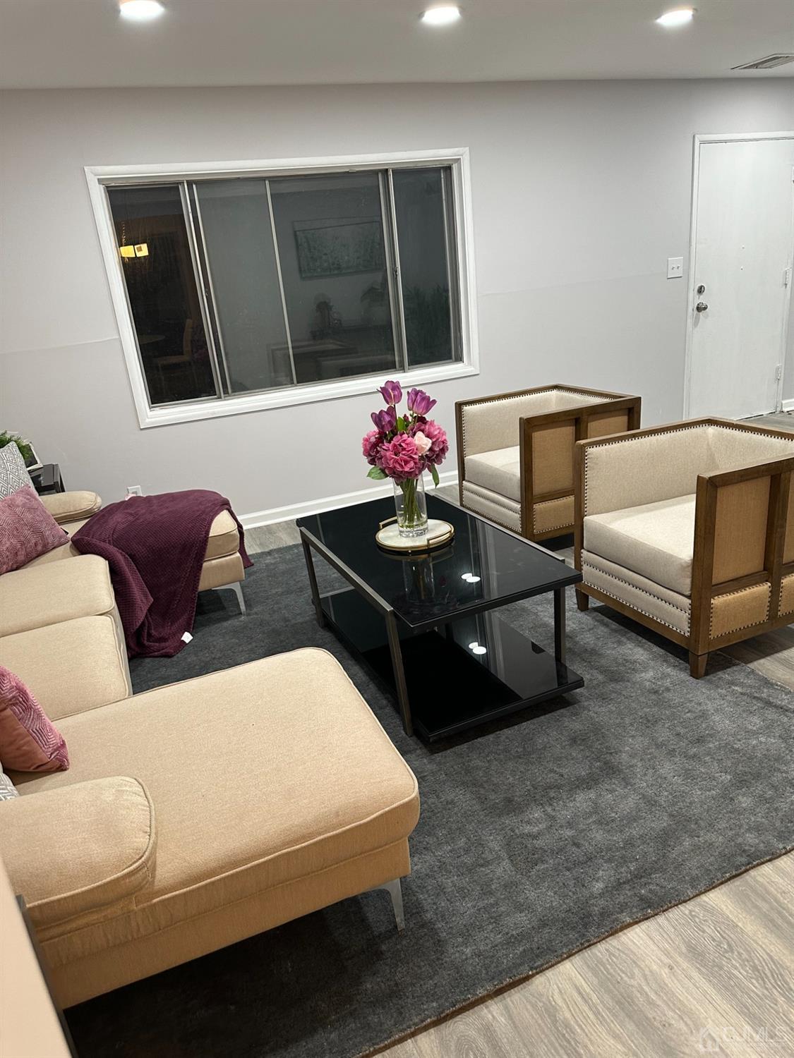 45 Raleigh Road Kendall Park, NJ 08824 - Photo 4 of 13 a living room with furniture and a flat screen tv