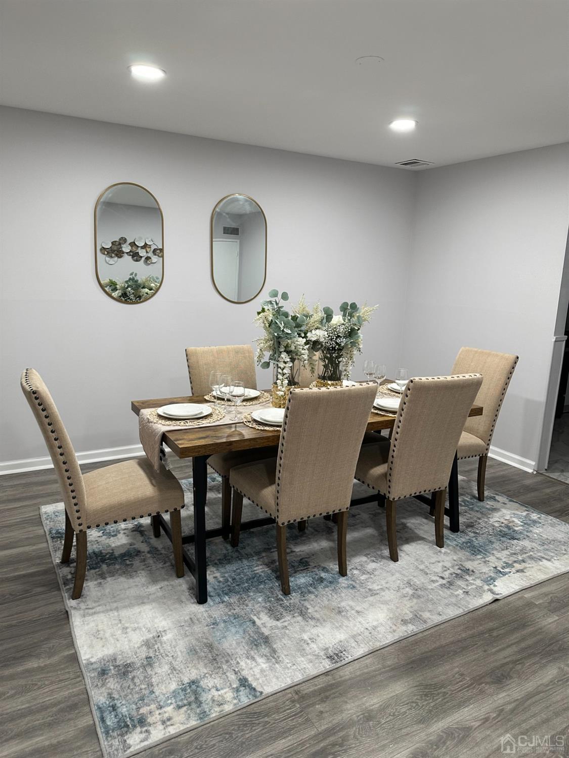 45 Raleigh Road Kendall Park, NJ 08824 - Photo 5 of 13 a view of a dining room with furniture and wooden floor