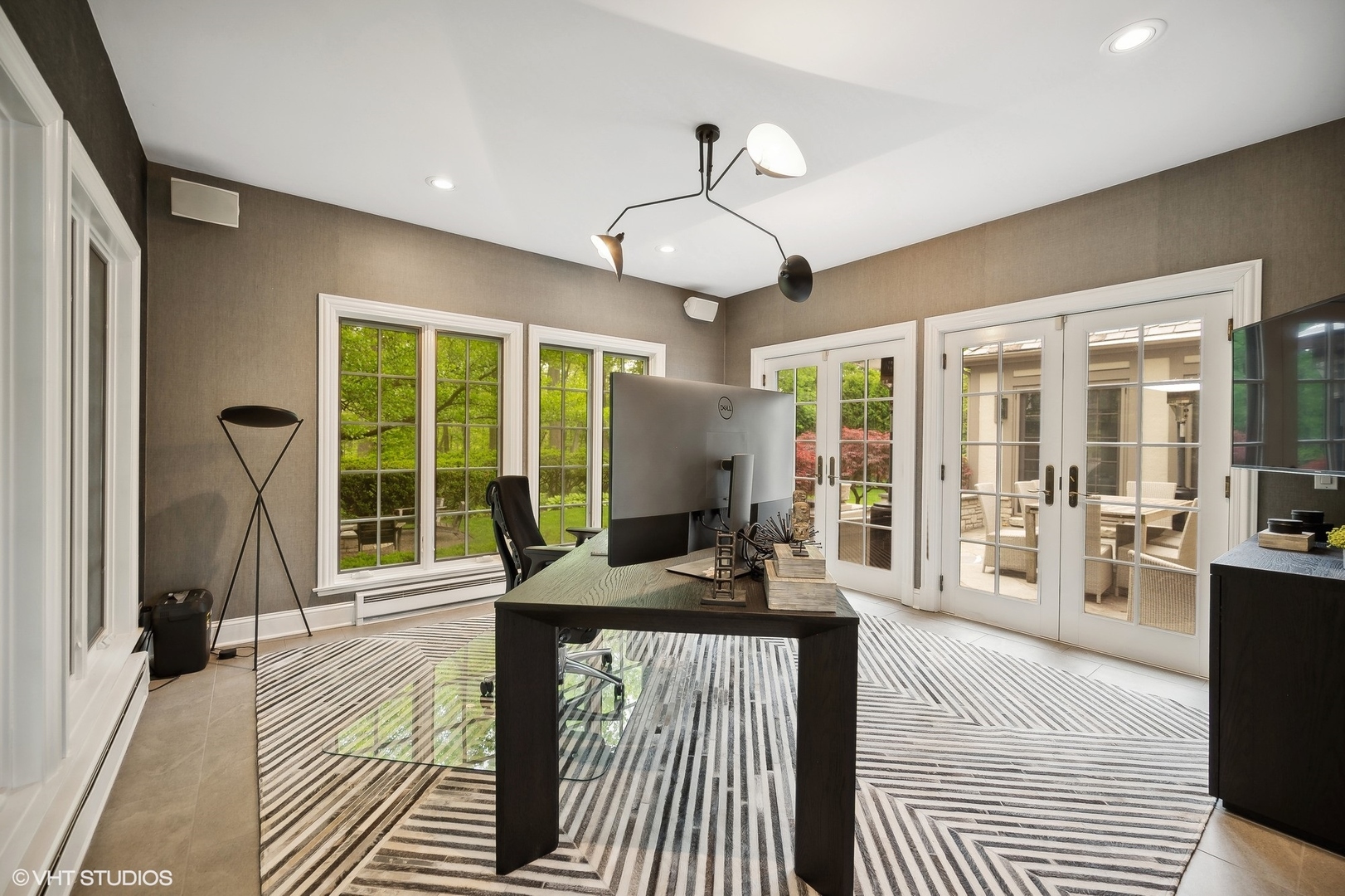 851 Sheridan Road Winnetka, IL 60093 - Photo 16 of 66 a very nice looking bedroom with a large window a chandelier and balcony